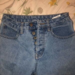 light wash mom jeans with frayed edges